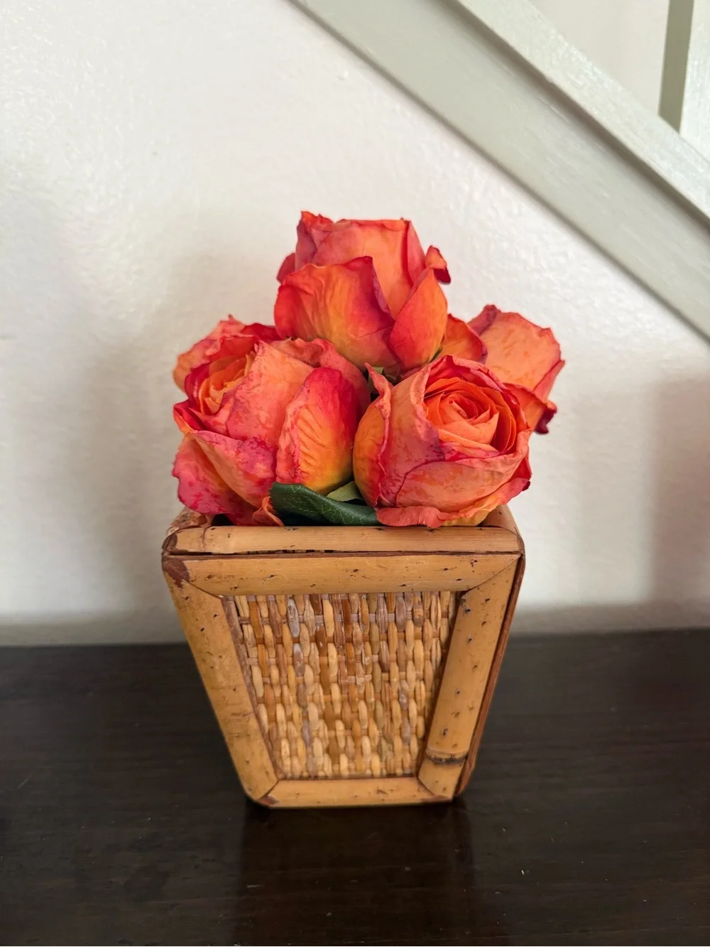 Vibrant Orange Rose Bouquet in Woven Planter